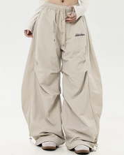 Pantalon parachute oversize​